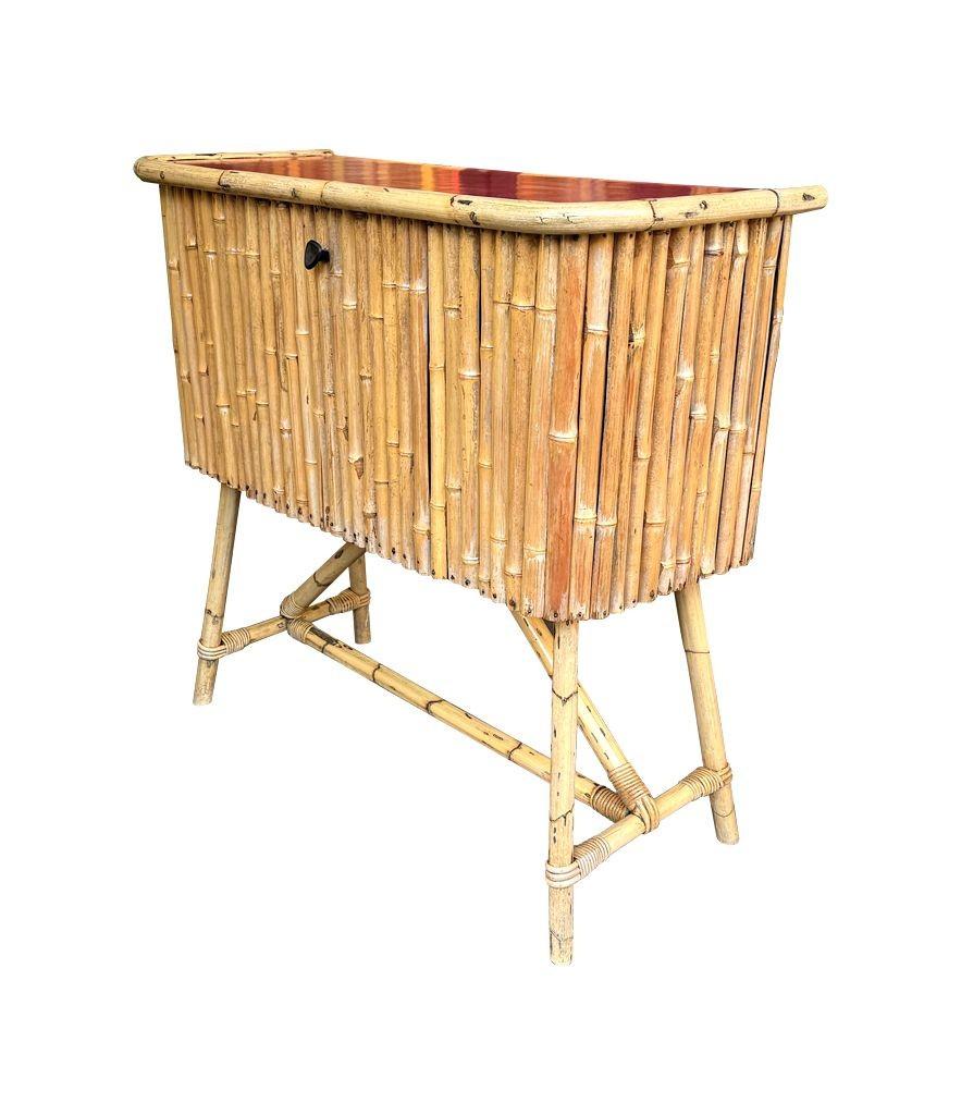 An Italian 1960s bamboo bar cabinet with red laminate top and two stools For Sale 6
