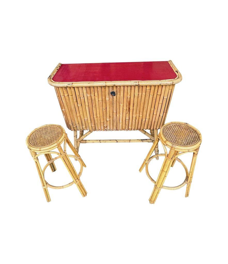 An Italian 1960s bamboo bar cabinet with red laminate top and two stools For Sale 9