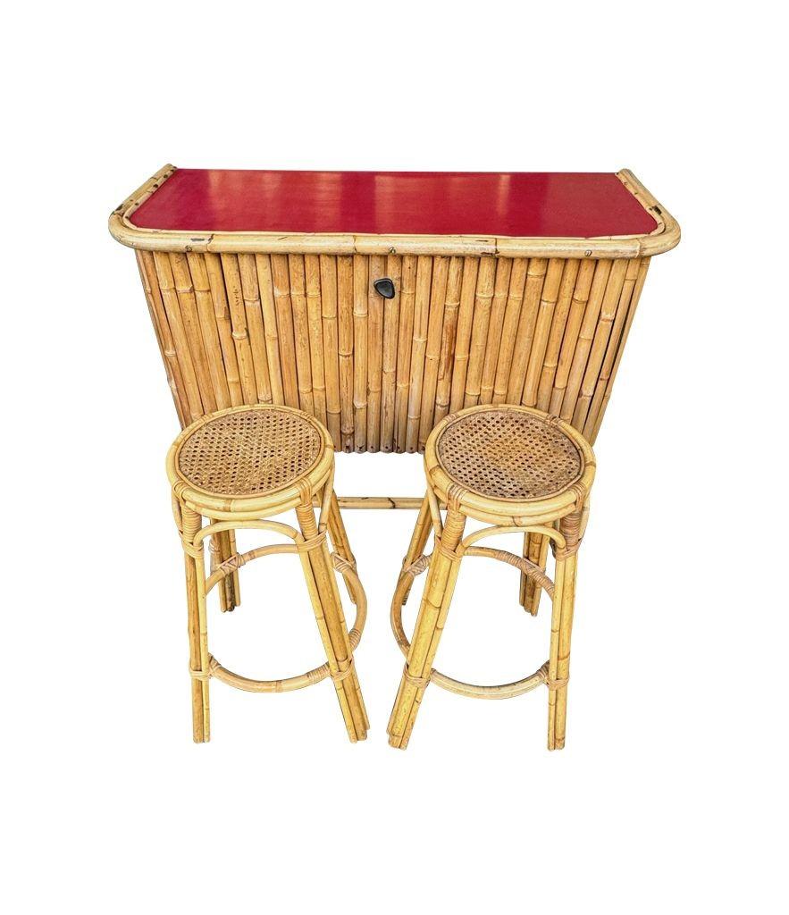 An Italian 1960s bamboo bar cabinet with red laminate top and two stools For Sale 10