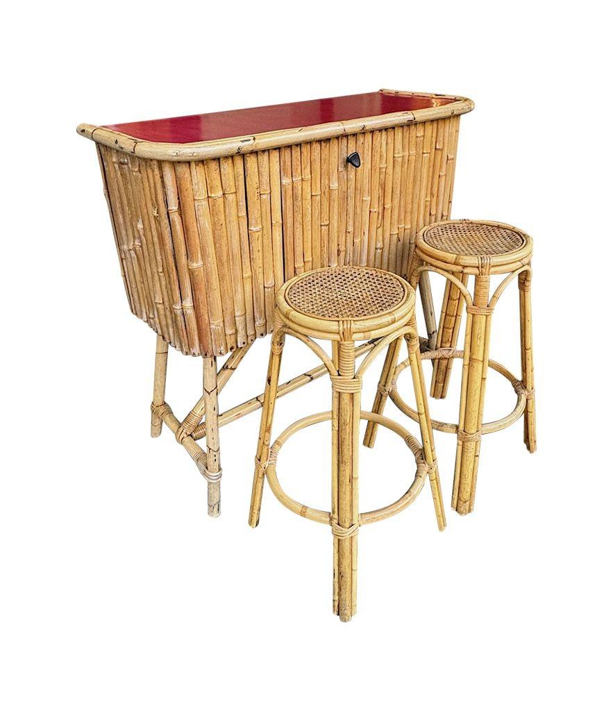 An Italian 1960s bamboo bar cabinet with red laminate top and two stools For Sale 11