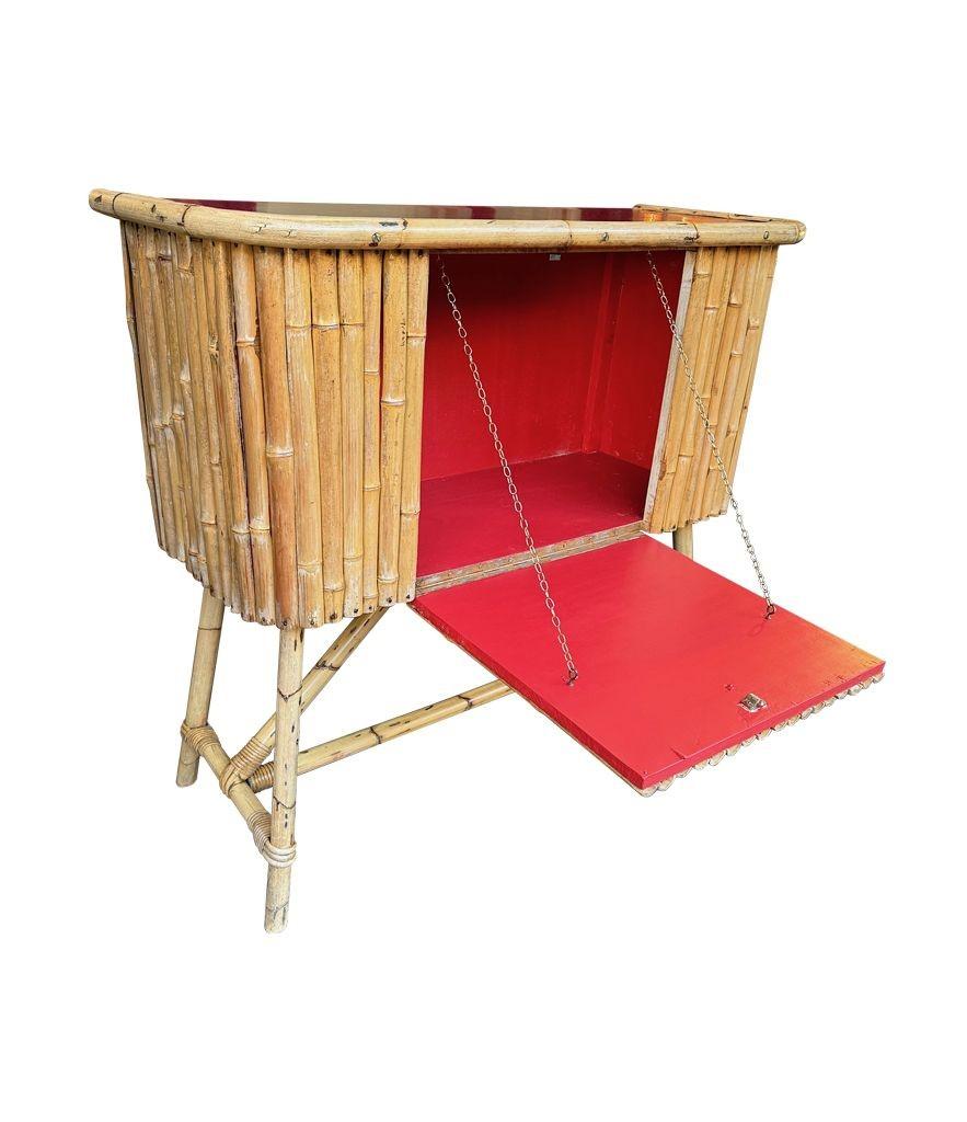 Mid-20th Century An Italian 1960s bamboo bar cabinet with red laminate top and two stools For Sale