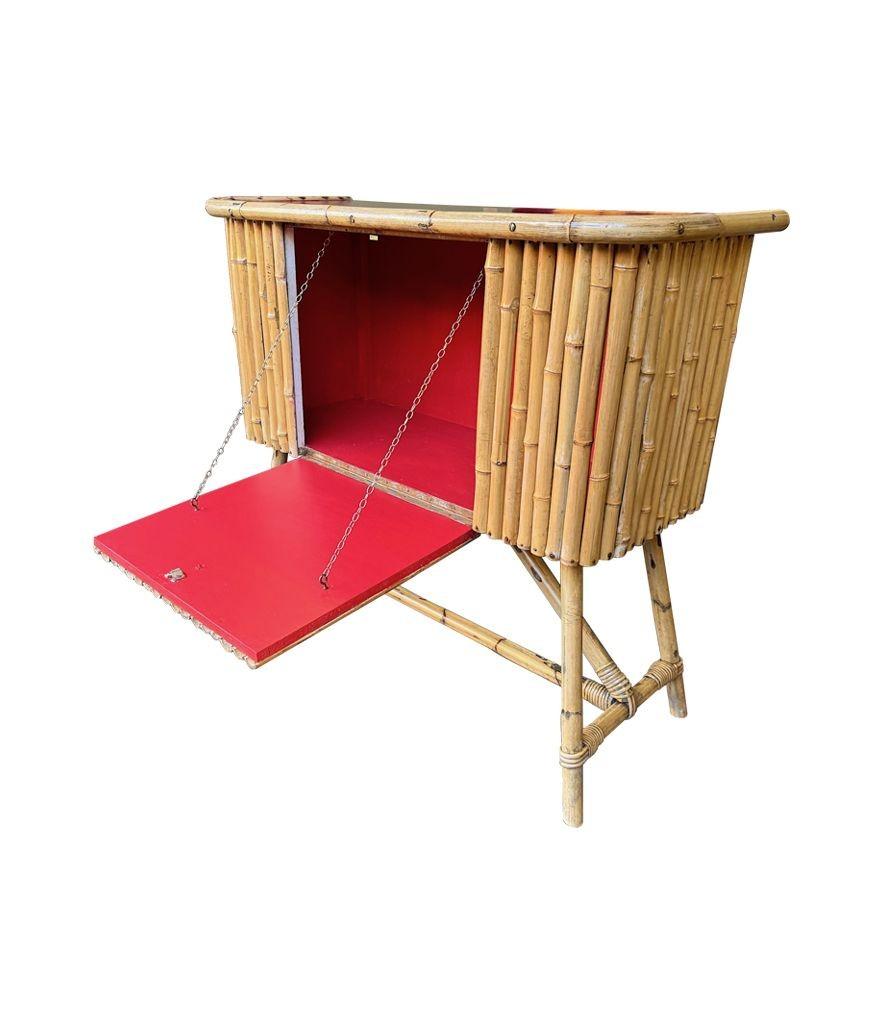 An Italian 1960s bamboo bar cabinet with red laminate top and two stools For Sale 1