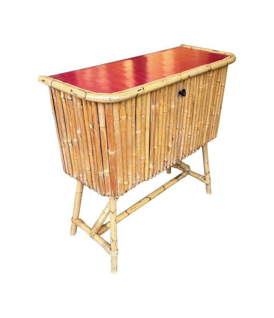 An Italian 1960s bamboo bar cabinet with red laminate top and two stools For Sale 2