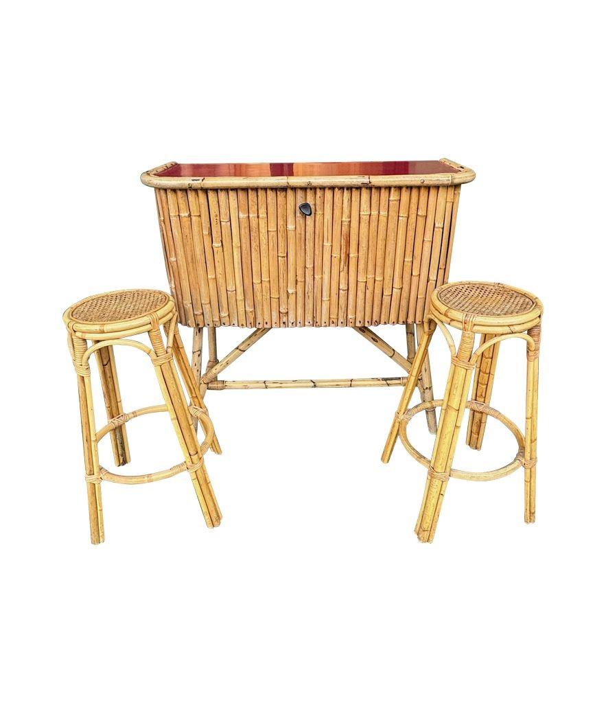 An Italian 1960s bamboo bar cabinet with red laminate top and two stools For Sale 3