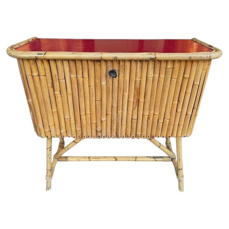 An Italian 1960s bamboo bar cabinet with red laminate top For Sale
