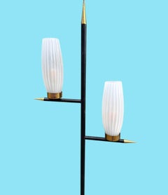 An Italian 1960s black lacquer and brass floor lamp with opaline glass shades