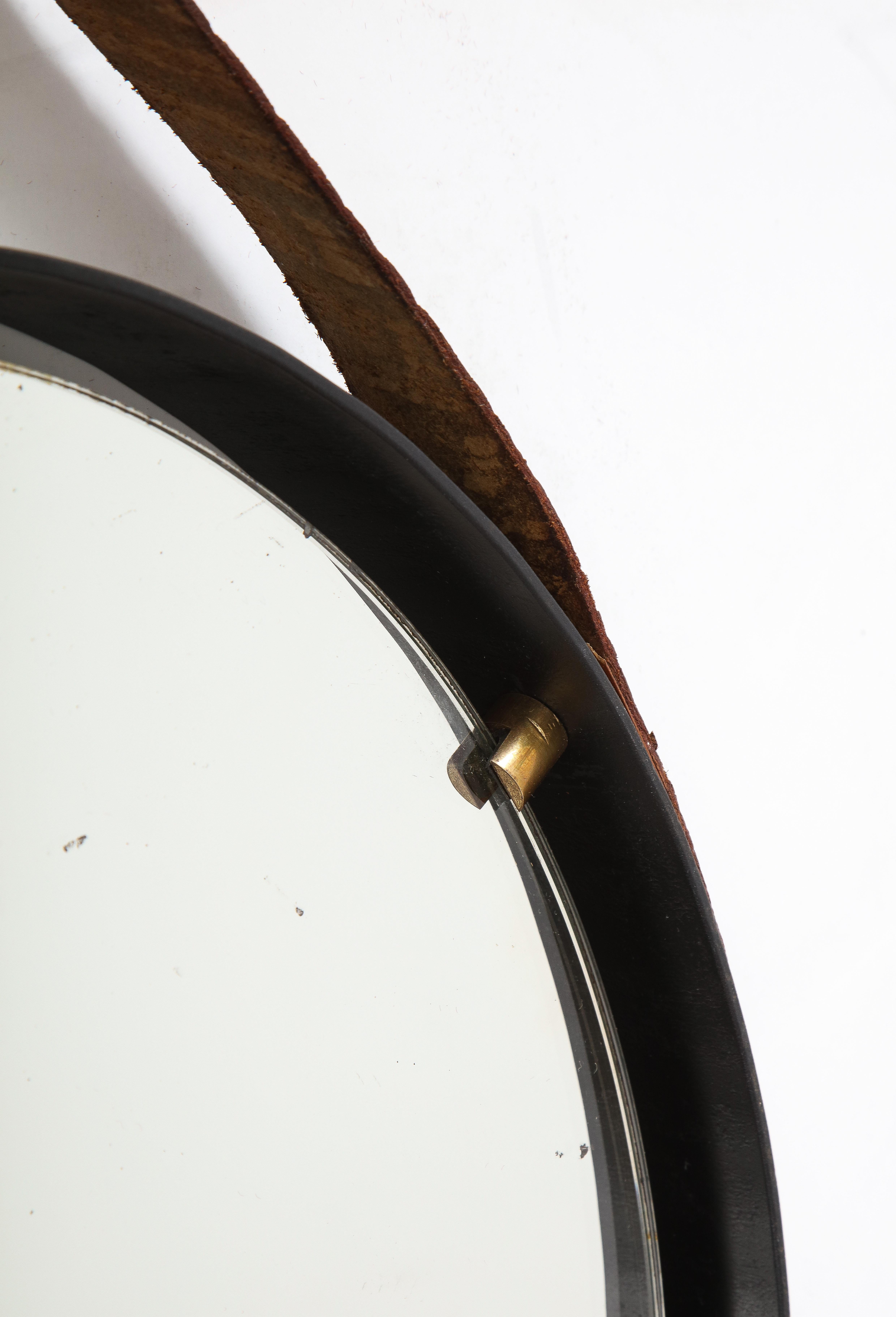 Brass Italian 1960's Circular Floating Mirror with Leather Strap For Sale