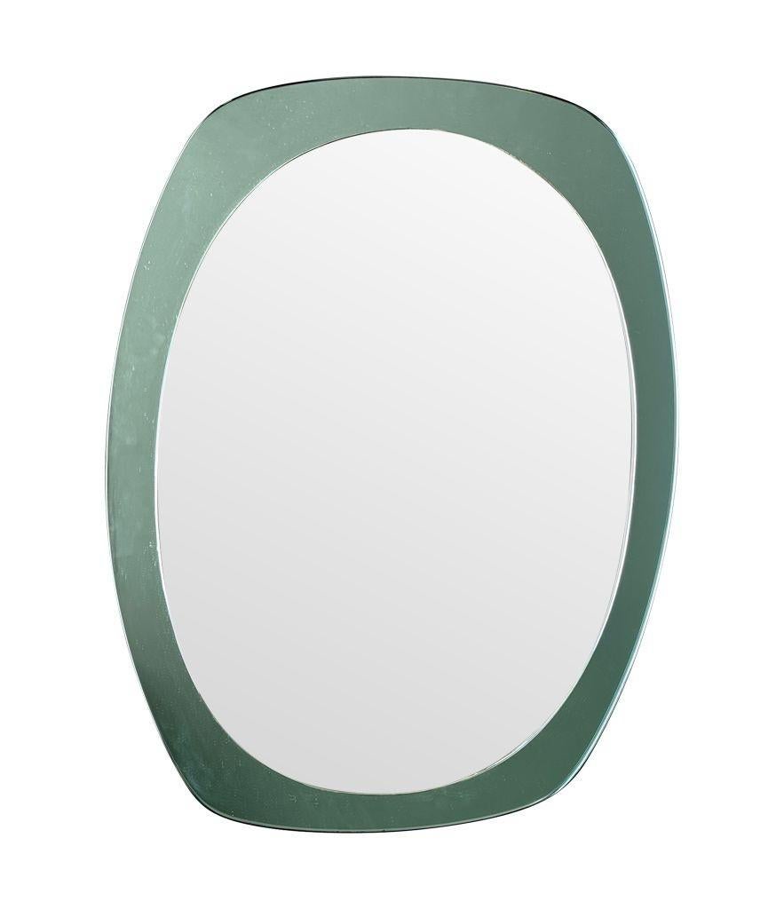 An Italian 1960s Cristal Arte oval mirror with mint green mirrored frame For Sale 5