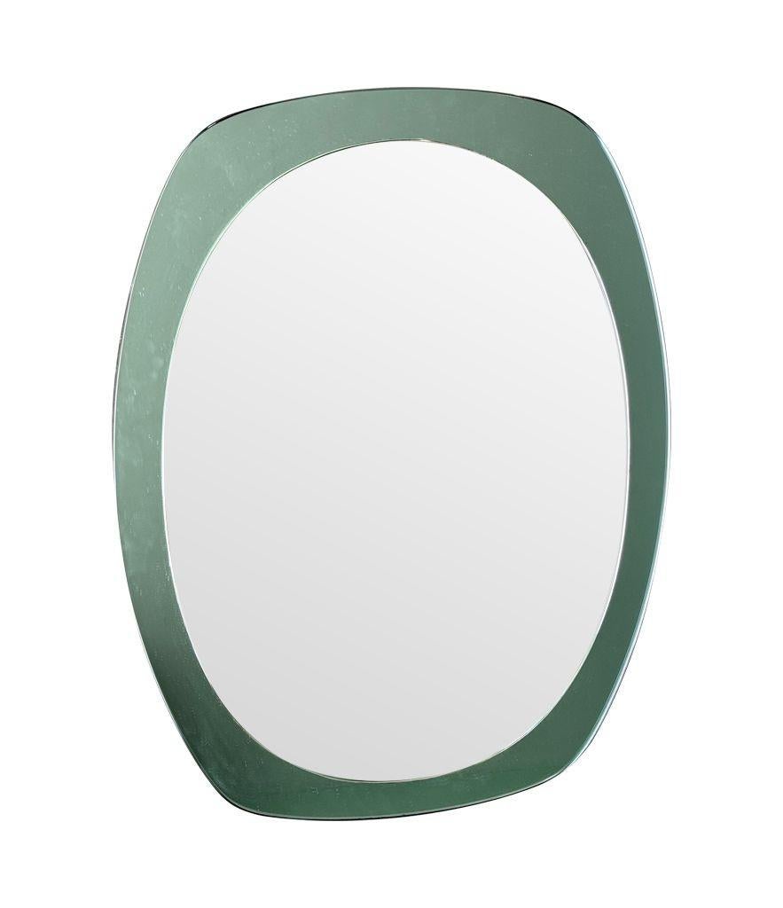 An Italian 1960s Cristal Arte oval mirror with mint green mirrored frame For Sale 7
