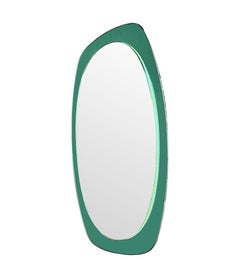 An Italian 1960s Cristal Arte oval mirror with mint green mirrored frame