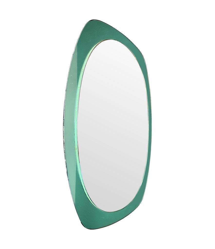 Late 20th Century An Italian 1960s Cristal Arte oval mirror with mint green mirrored frame For Sale