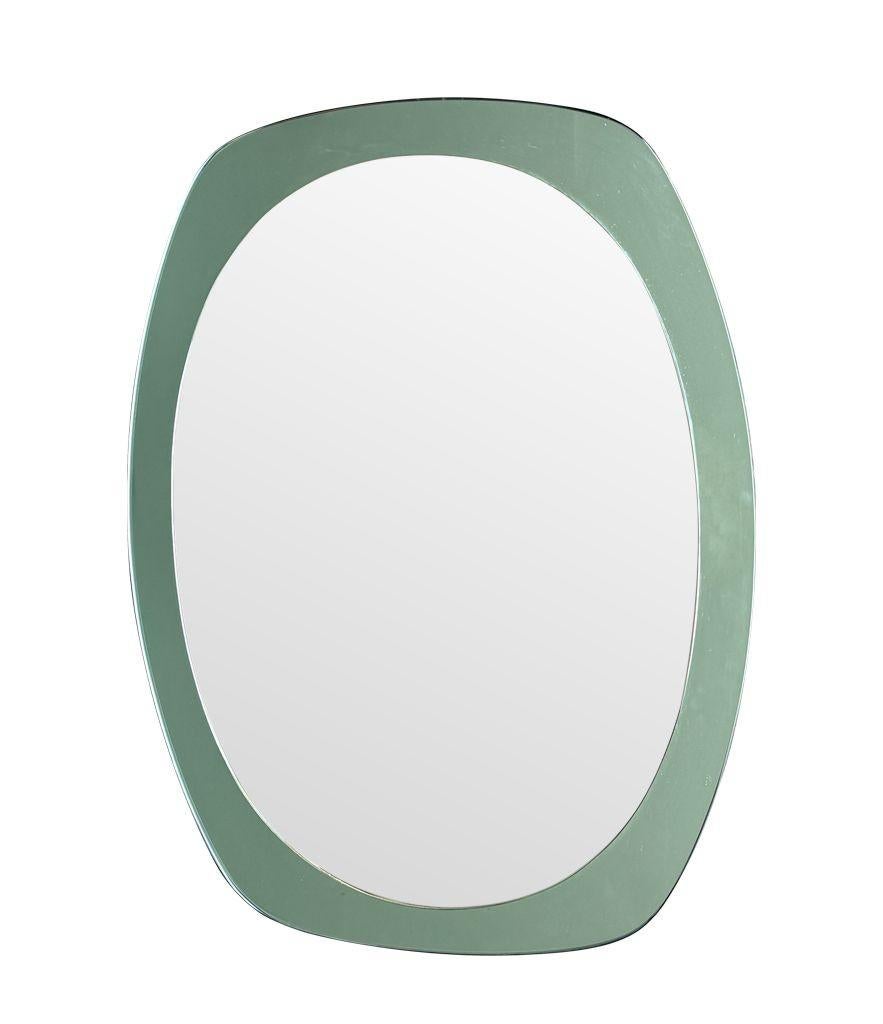 Mirror An Italian 1960s Cristal Arte oval mirror with mint green mirrored frame For Sale