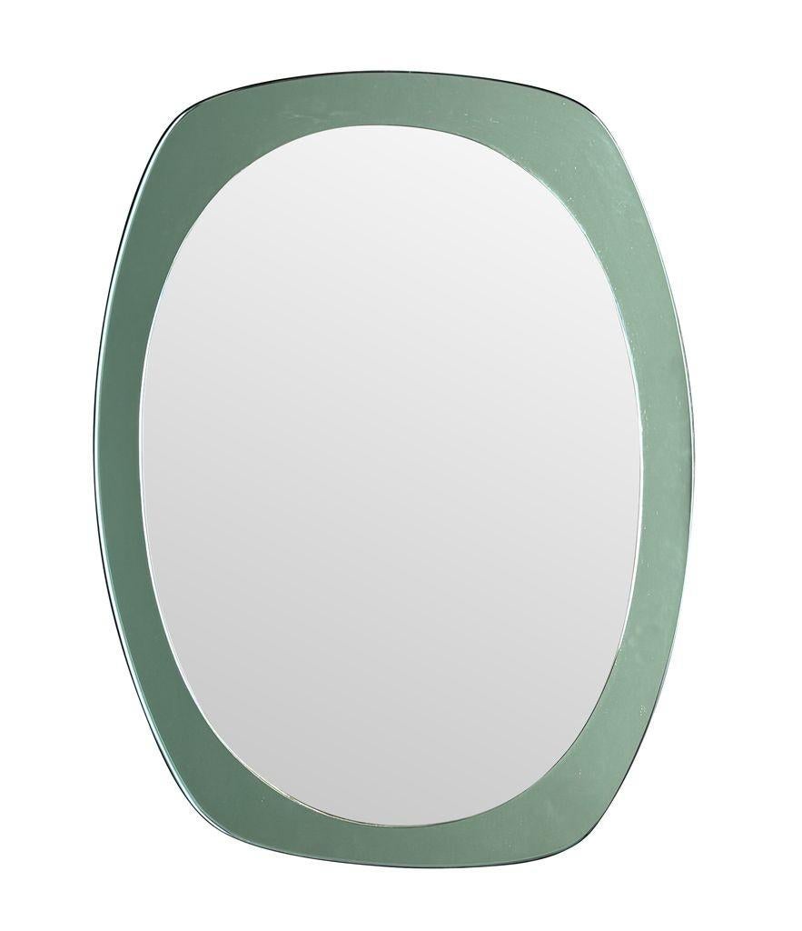 An Italian 1960s Cristal Arte oval mirror with mint green mirrored frame For Sale 1