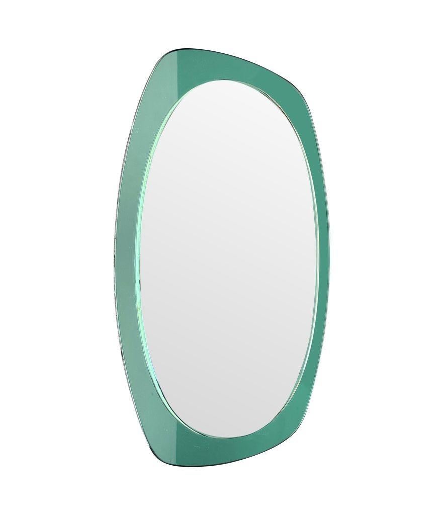 An Italian 1960s Cristal Arte oval mirror with mint green mirrored frame For Sale 2