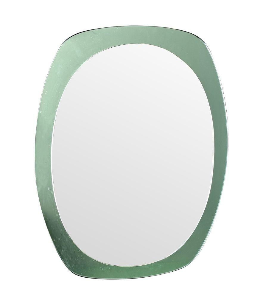 An Italian 1960s Cristal Arte oval mirror with mint green mirrored frame For Sale 3