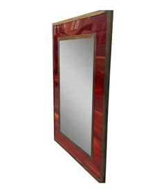 An Italian 1970s Faux tortoiseshell and brass landscape or portrait mirror
