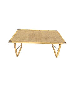 An Italian 1970s folding bamboo coffee table by Del Vera with brass corners