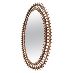 An Italian 1970s oval split cane bamboo mirror by Franco Albini for Bonacina