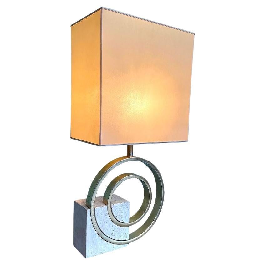 An Italian 1970s sculptural travertine and brass lamp by Giovanni Banci For Sale