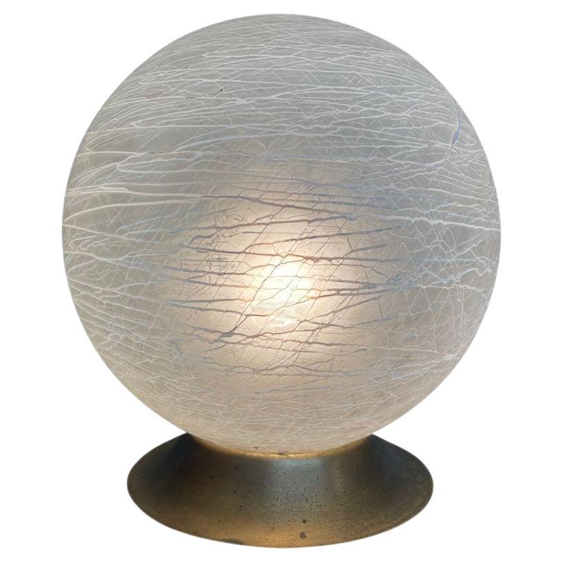 An Italian 1970s Venini Murano glass swirl ball lamp on brass base