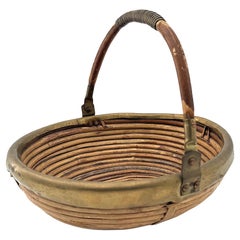 An Italian 1970s woven bamboo and brass bowl in the style of Gabriella Crespi