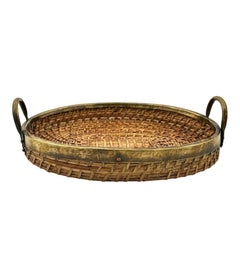 An Italian 1970s woven pencil reed bamboo and brass basket with brass handles