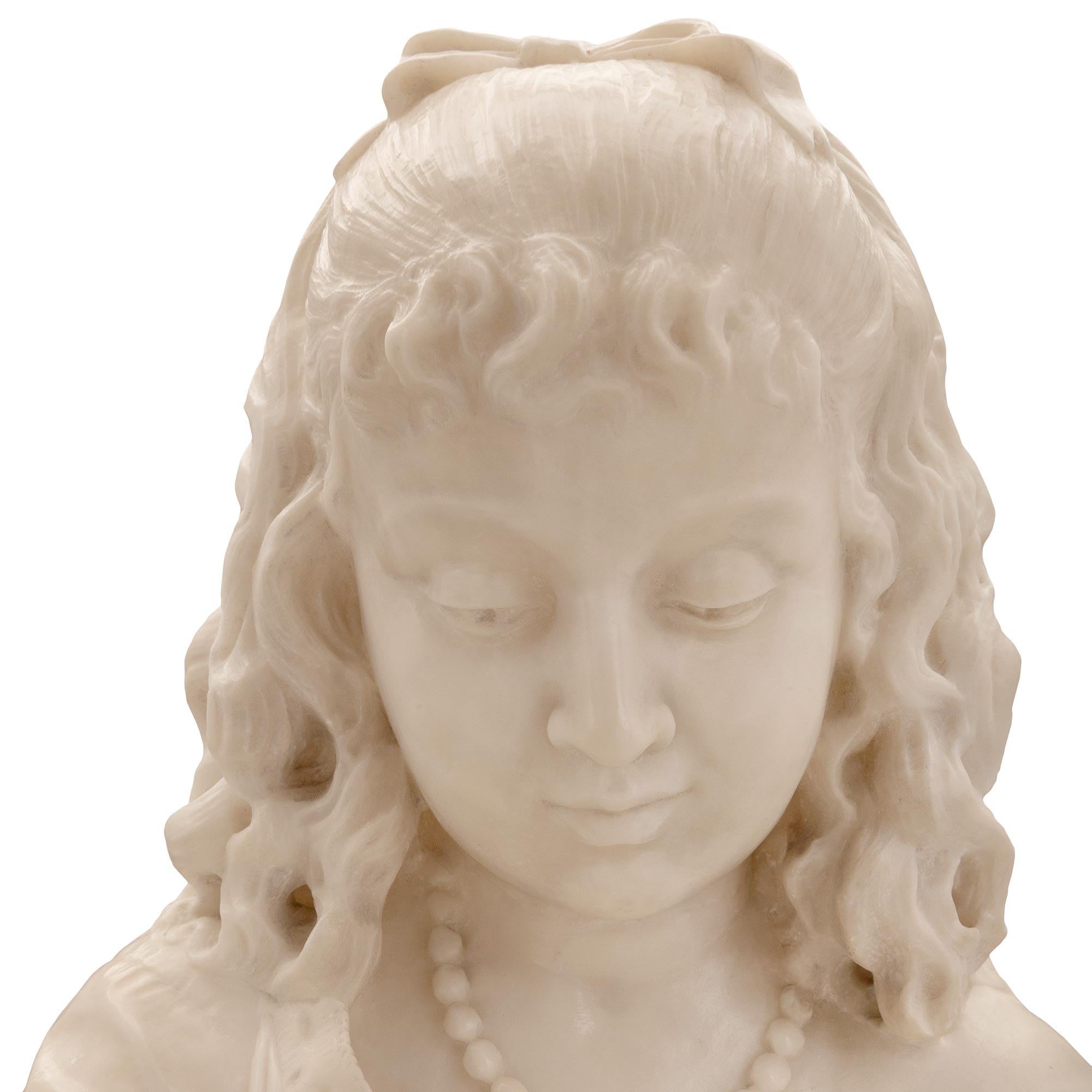 A stunning and extremely high quality Italian 19th century Alabaster statue of a young girl feeding birds. The statue is raised by an oblong base with a lovely paved ground like design where a charming finely detailed bird is eating grains off the