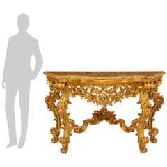An Italian 19th century Louis XV st. Giltwood and Breche D’Alep marble console