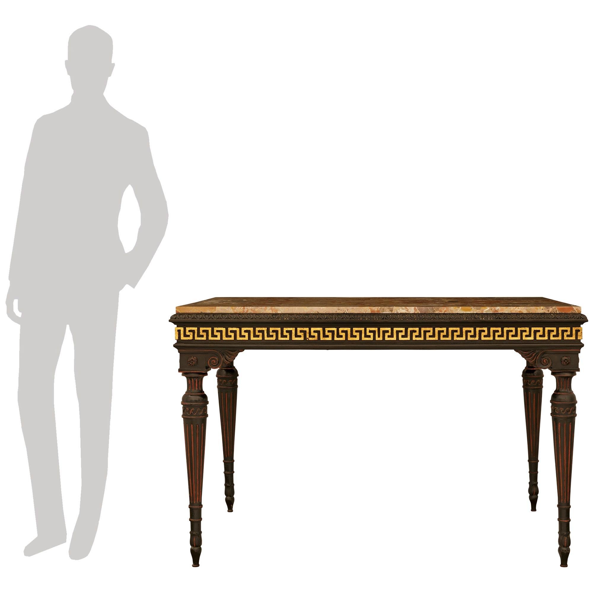 A superb and most decorative Italian 19th century Louis XVI st. patinated Wood, Giltwood and Breccia Pernice marble console. This wonderful console is raised by four tapered fluted legs decorated by acanthus leaves and Vitruvian scroll motif leading