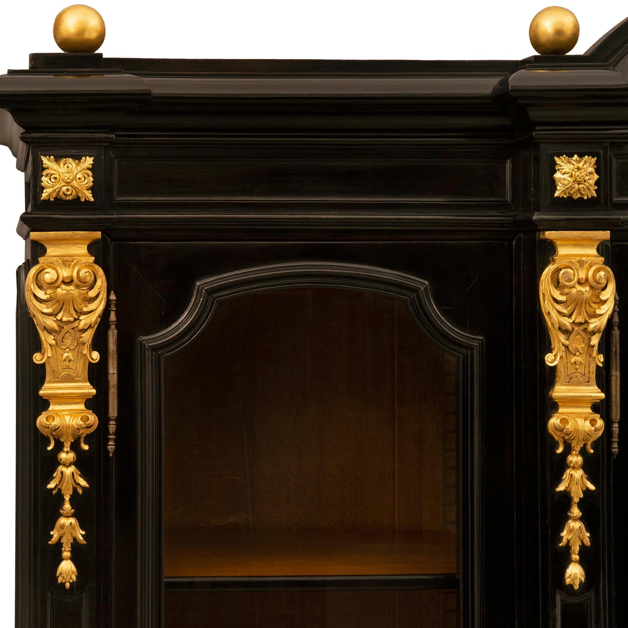 An Italian 19th century Rococo Revival st. ebonized giltwood vitrine For Sale 2