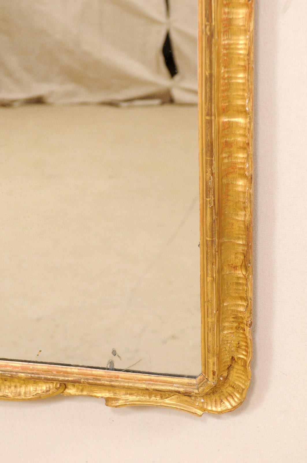 An Italian 5.5 Ft Tall Carved Giltwood Wall Mirror, from the Early 20th Century  5