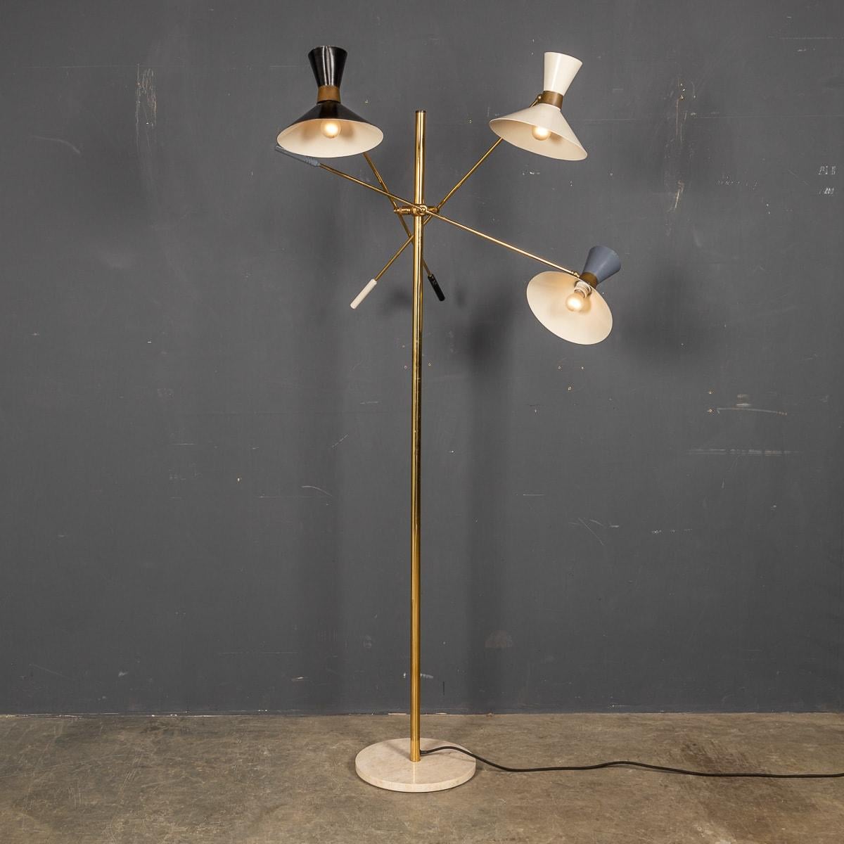 A stylish 20th Century Italian articulated standing lamp with three movable brass arms, brass body column and supported by original thick marble base. Original wiring and in working condition. Based on the original design designed by Bruno Gatta in