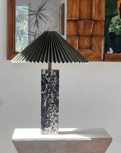 An Italian black marble table lamp with Danish pleated abat-jour shade, 20th c.