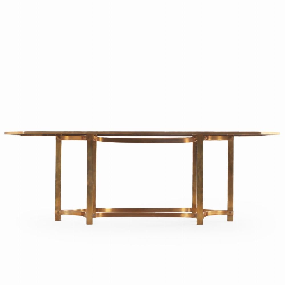 An Italian brass and smoked glass dining table, C. 1970. In Good Condition For Sale In Philadelphia, PA