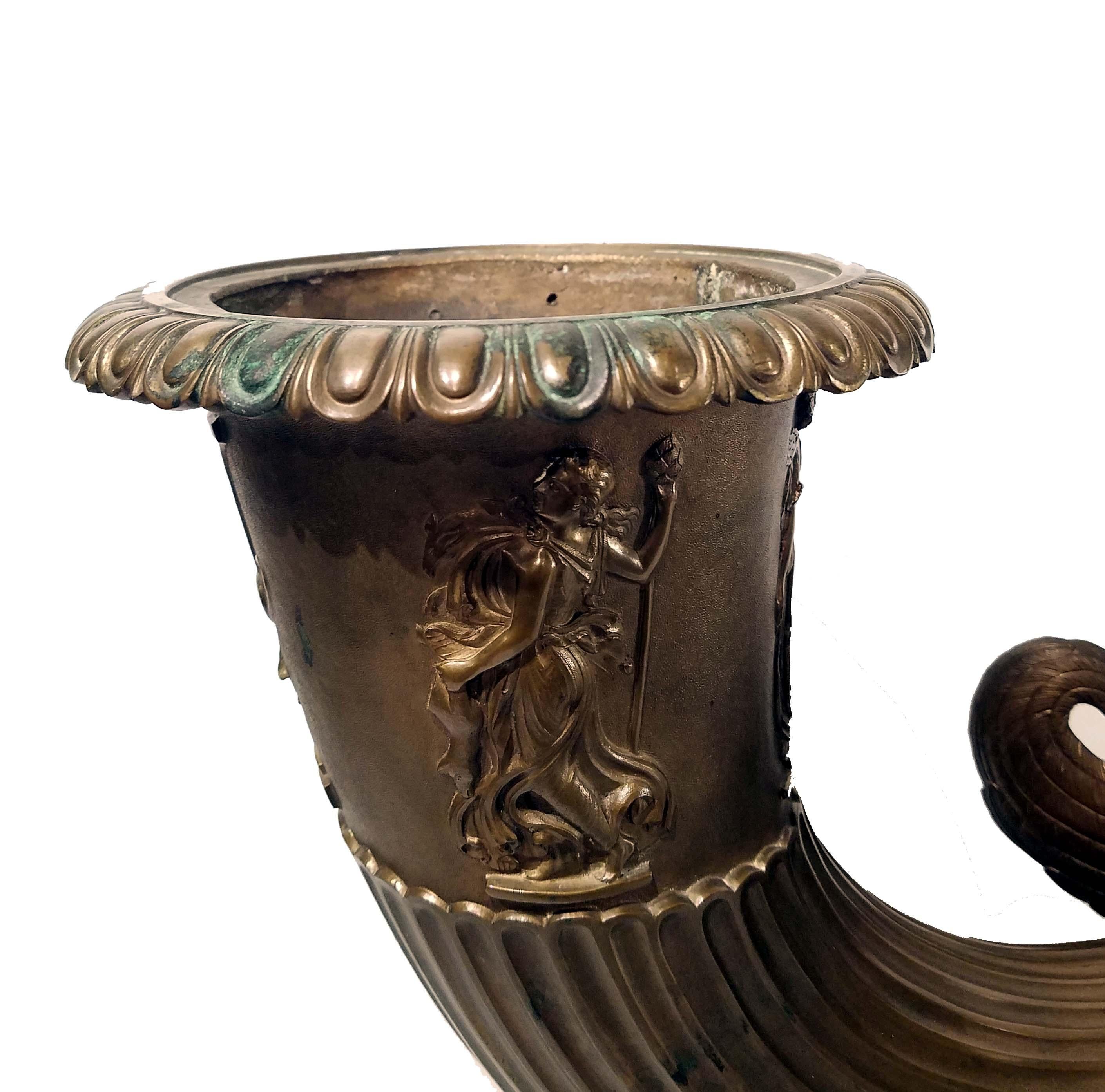 An Italian bronze Rhyton vase by Benedetto Boschetti, Rome, circa 1840. The vase cast with classical figures and an urn on folaite plinth and Belgian black marble, signed 'B. BOSCHETTI ROMA.'