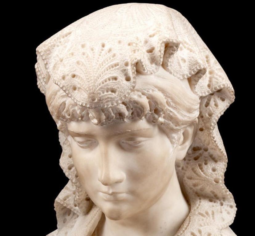 An Italian Carrara marble bust of a woman, the exquisite carving on her 