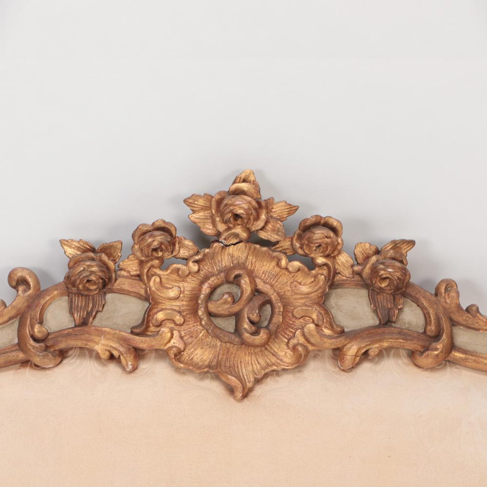 An Italian carved and painted giltwood King size headboard with upholstered panel circa 1900. This headboard is designed to be hung on the wall and can be used with or without the plain rectangular panel below.