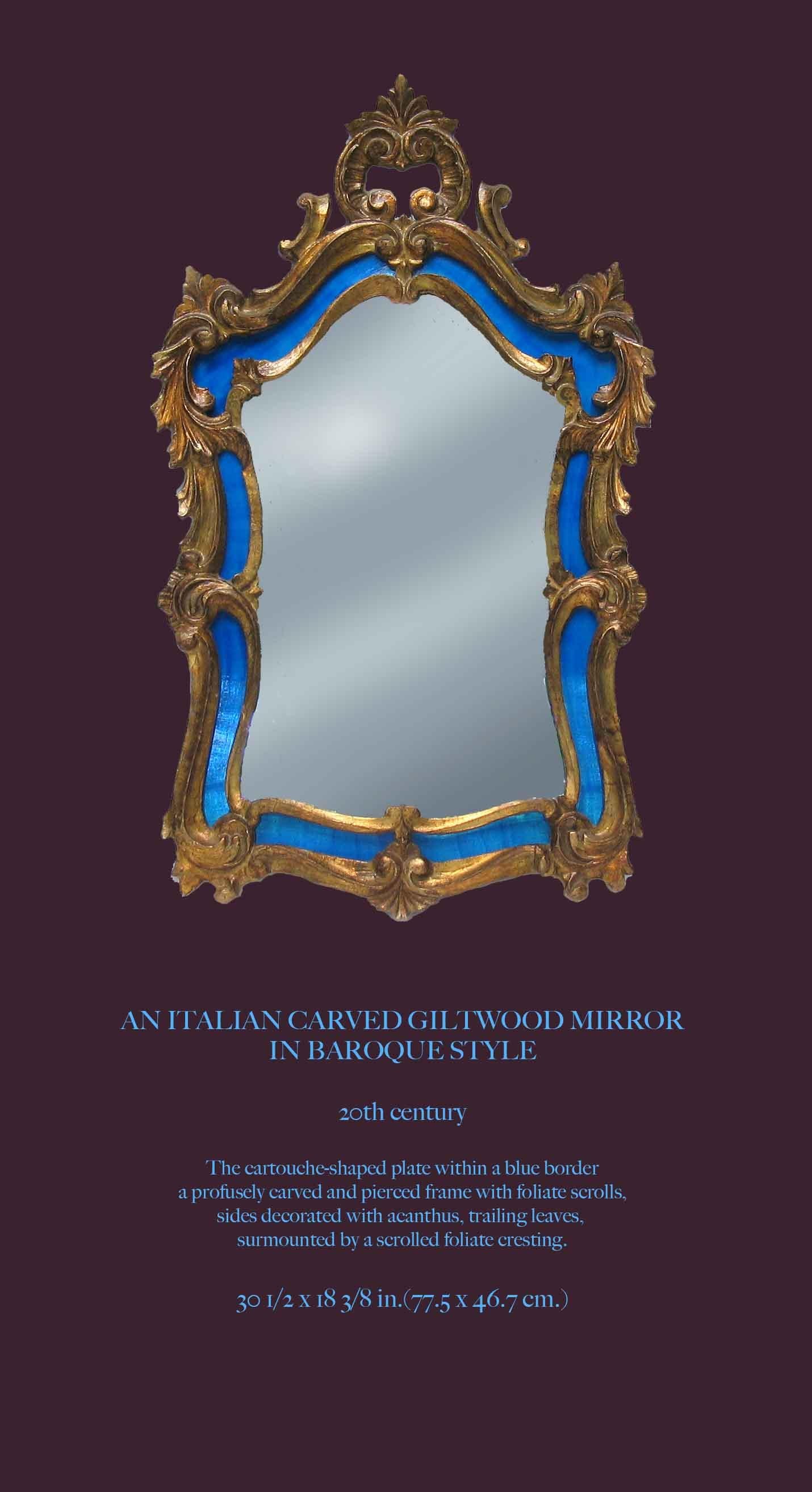 AN ITALIAN CARVED GILTWOOD MIRROR
IN BAROQUE STYLE

20th Century.

The cartouche-shaped plate within a blue border and profusely carved and pierced frame with foliate scrolls,
sides decorated with acanthus, trailing leaves,
surmounted by a scrolled