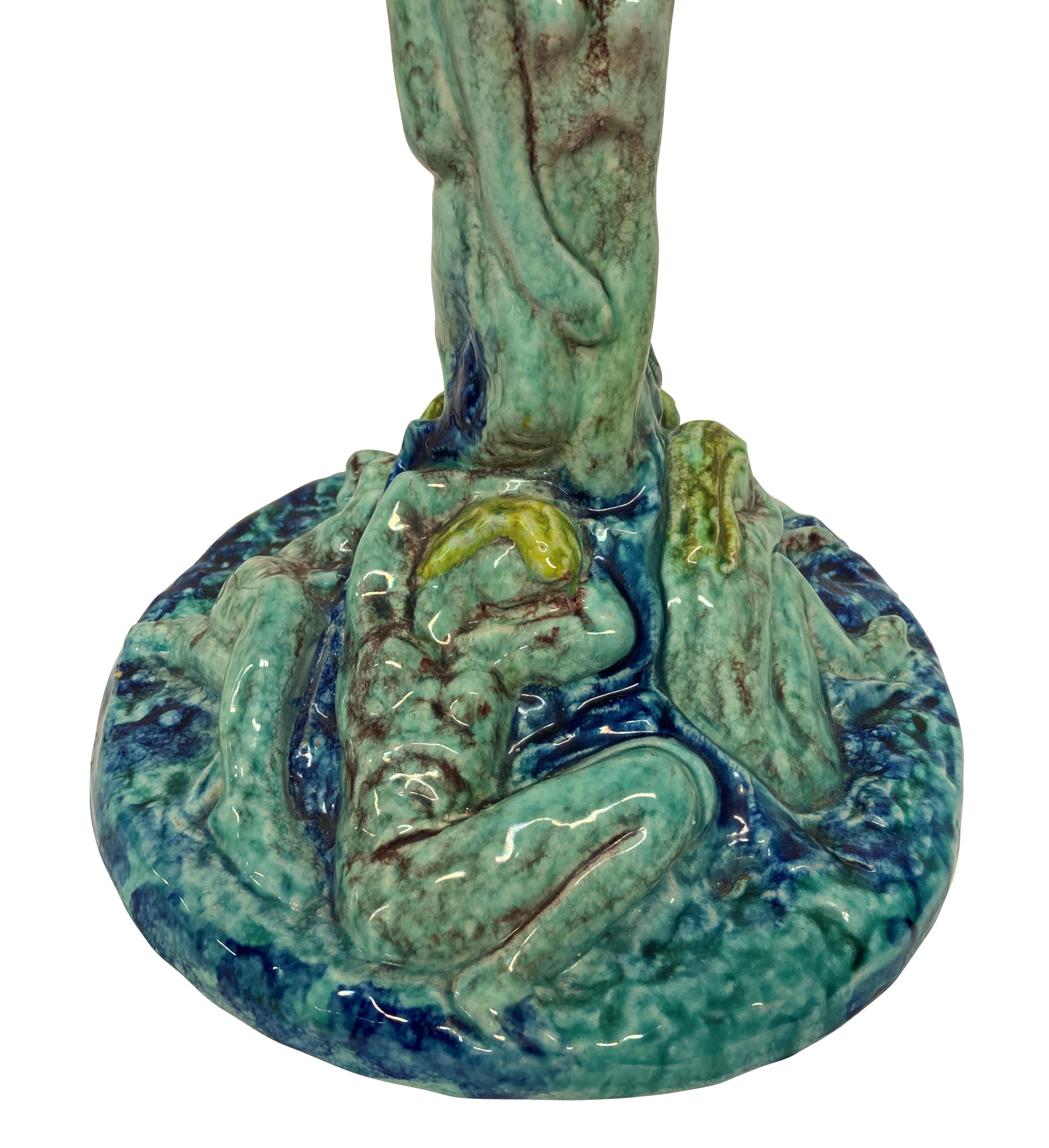 An Italian glazed ceramic floor lamp by Albisola, in the surrealist manner depicting nude female figures throughout.