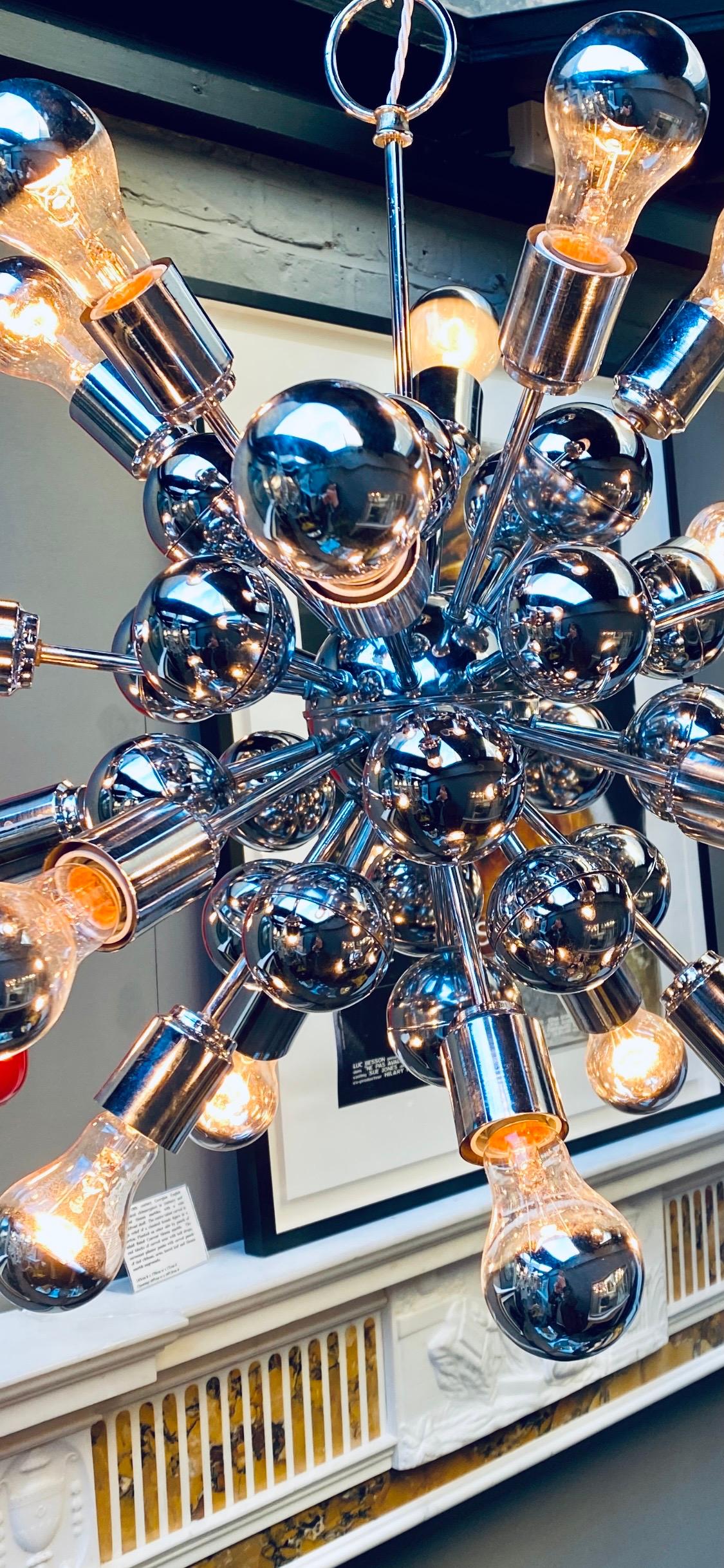 A large chrome 20-light Sputnik chandelier. Re-wired and restored. Italian late 1960s midcentury style
by Gaetano Sciolari.