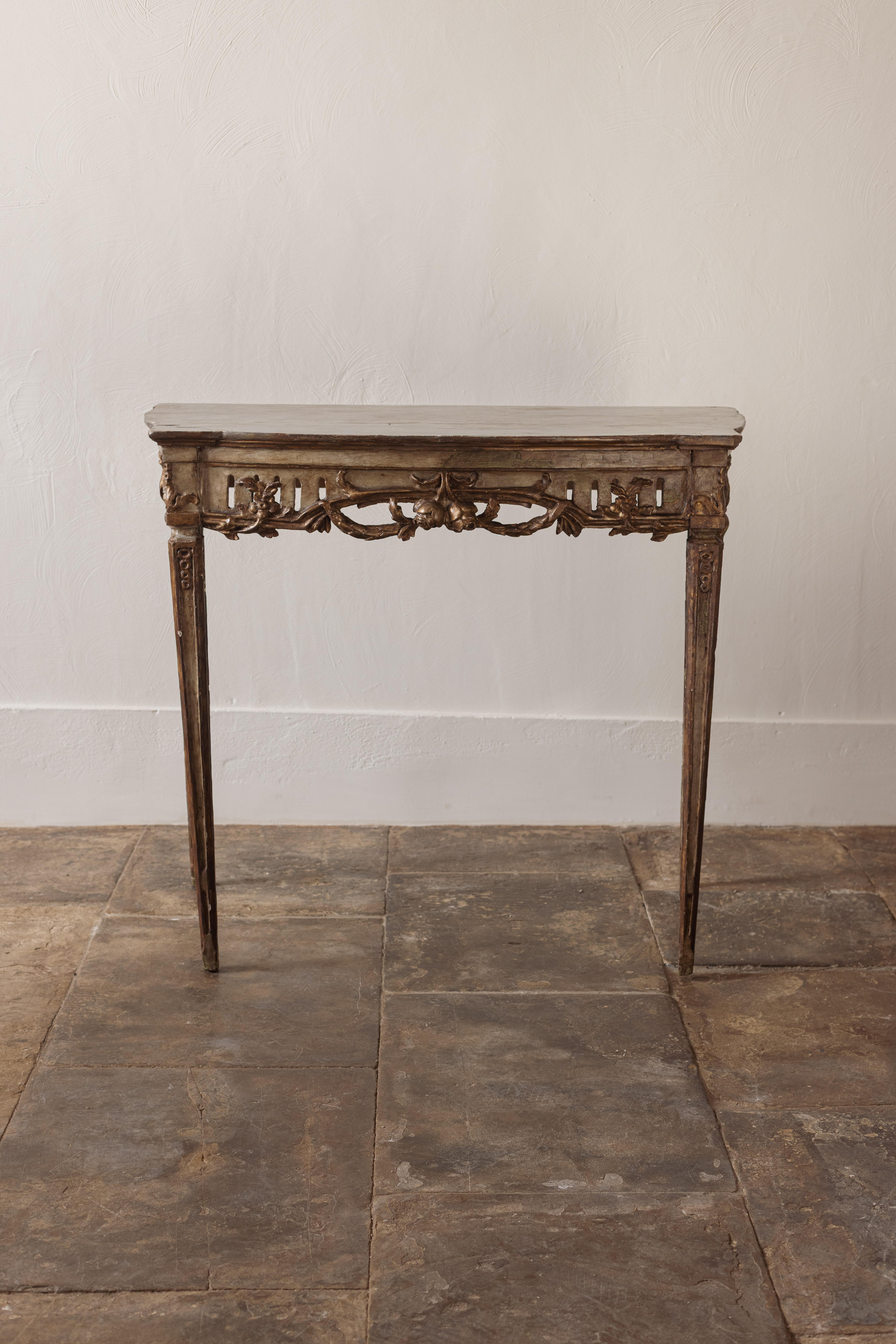 An unusual neo-classical console table with decorative detailing and attractive blue/green painted top.

An extremely useful size and shape that would suit a hall or drawings room. 

Italy, 18th Century
