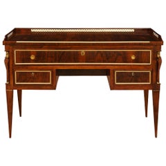 An Italian early 19th century Louis XVI st. Directoire Period Walnut, Brass and