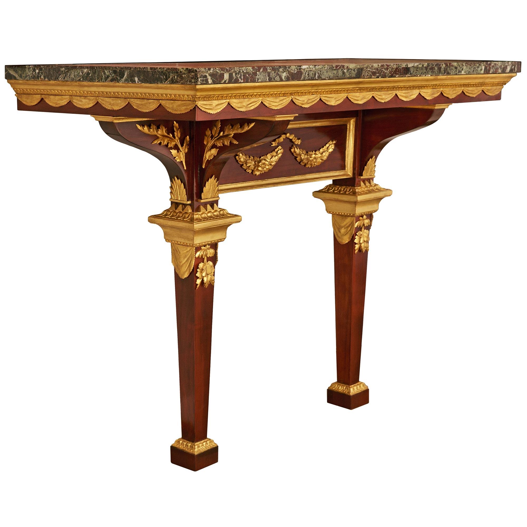 Empire An Italian early 19th century Mahogany, Giltwood and veneered marble console For Sale