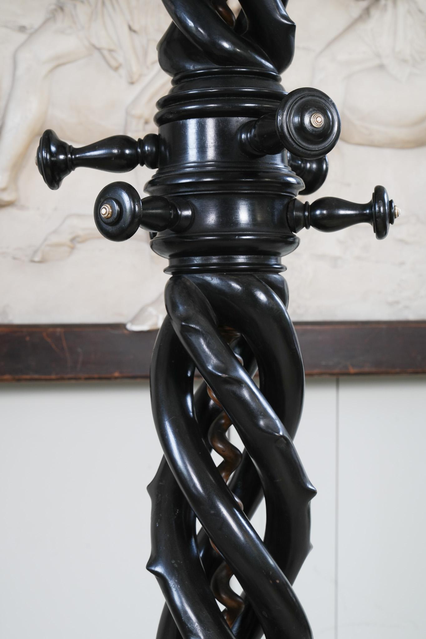 A 19th century freestanding ebonised hat and coat stand