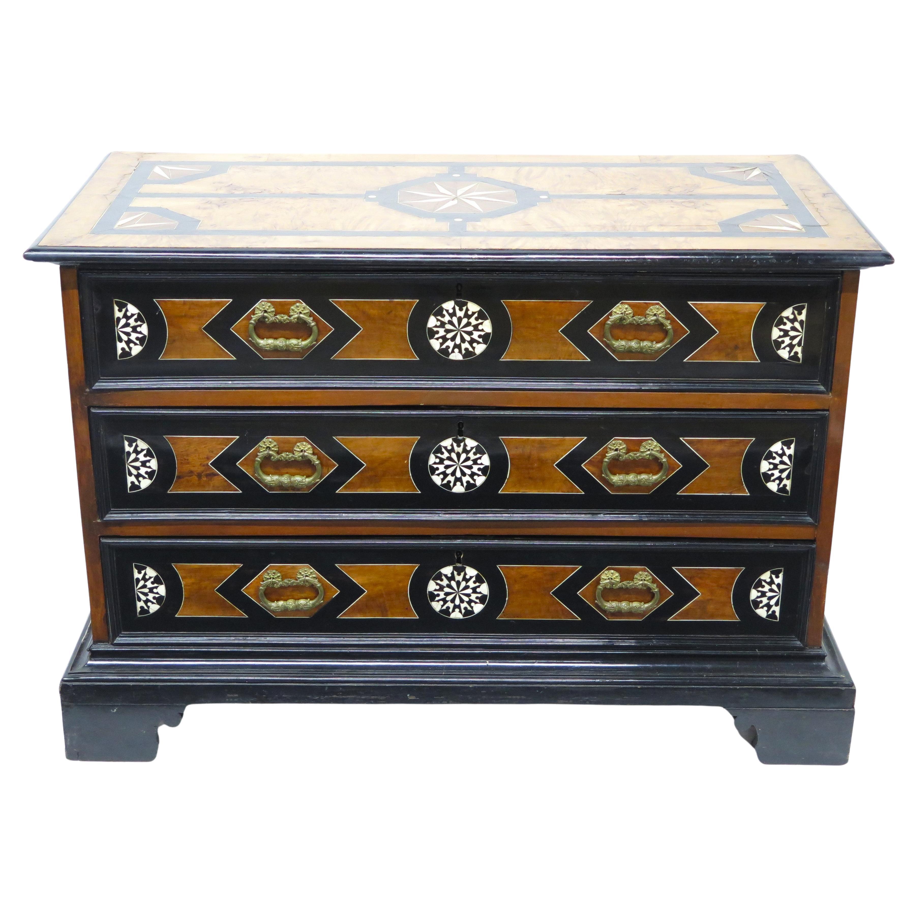 An Italian Ebonized Fruitwood and Bone Inlaid Three Drawer Commode For Sale