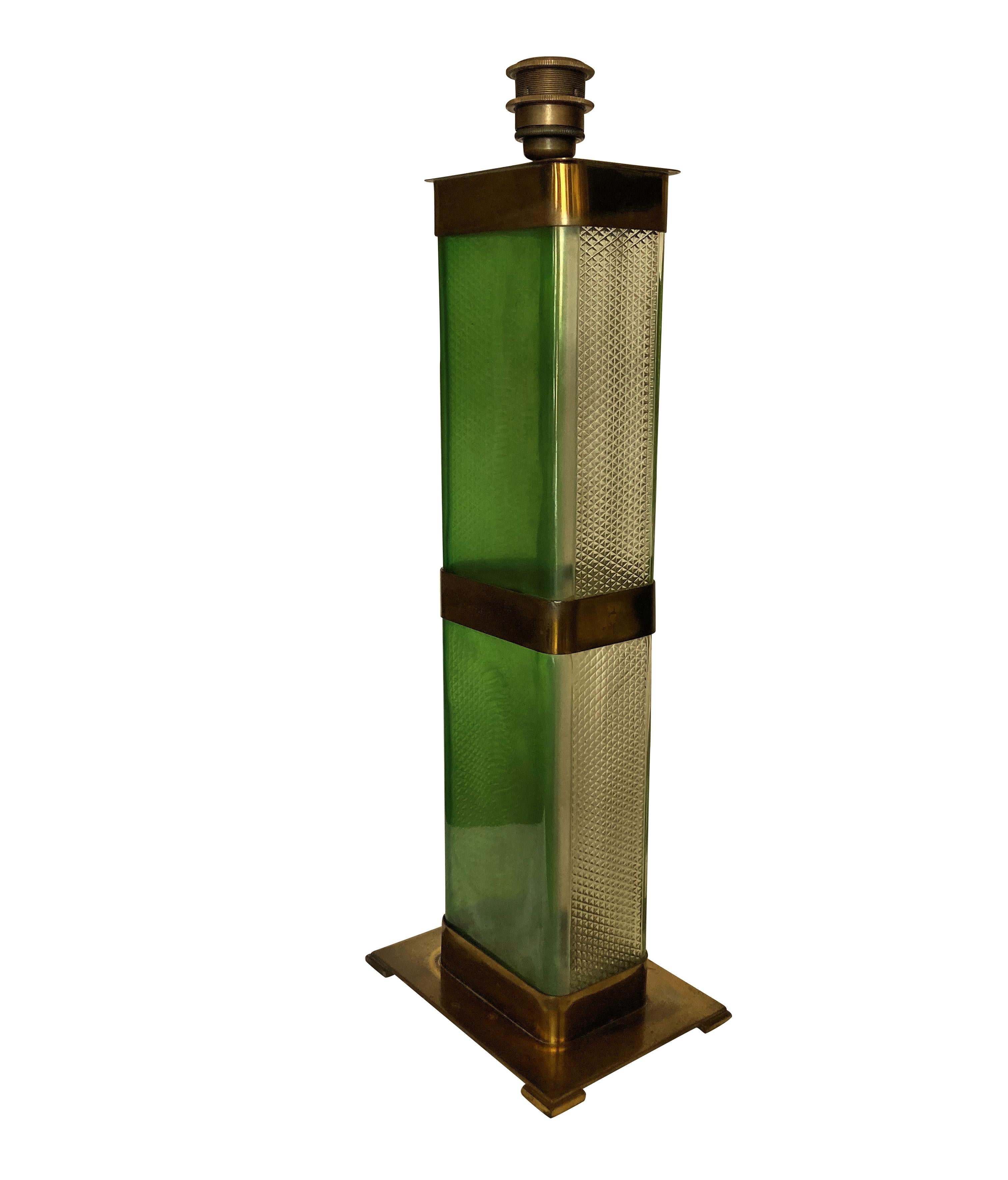 A stylish Italian Mid-Century emerald green glass table lamp with brass detailing.