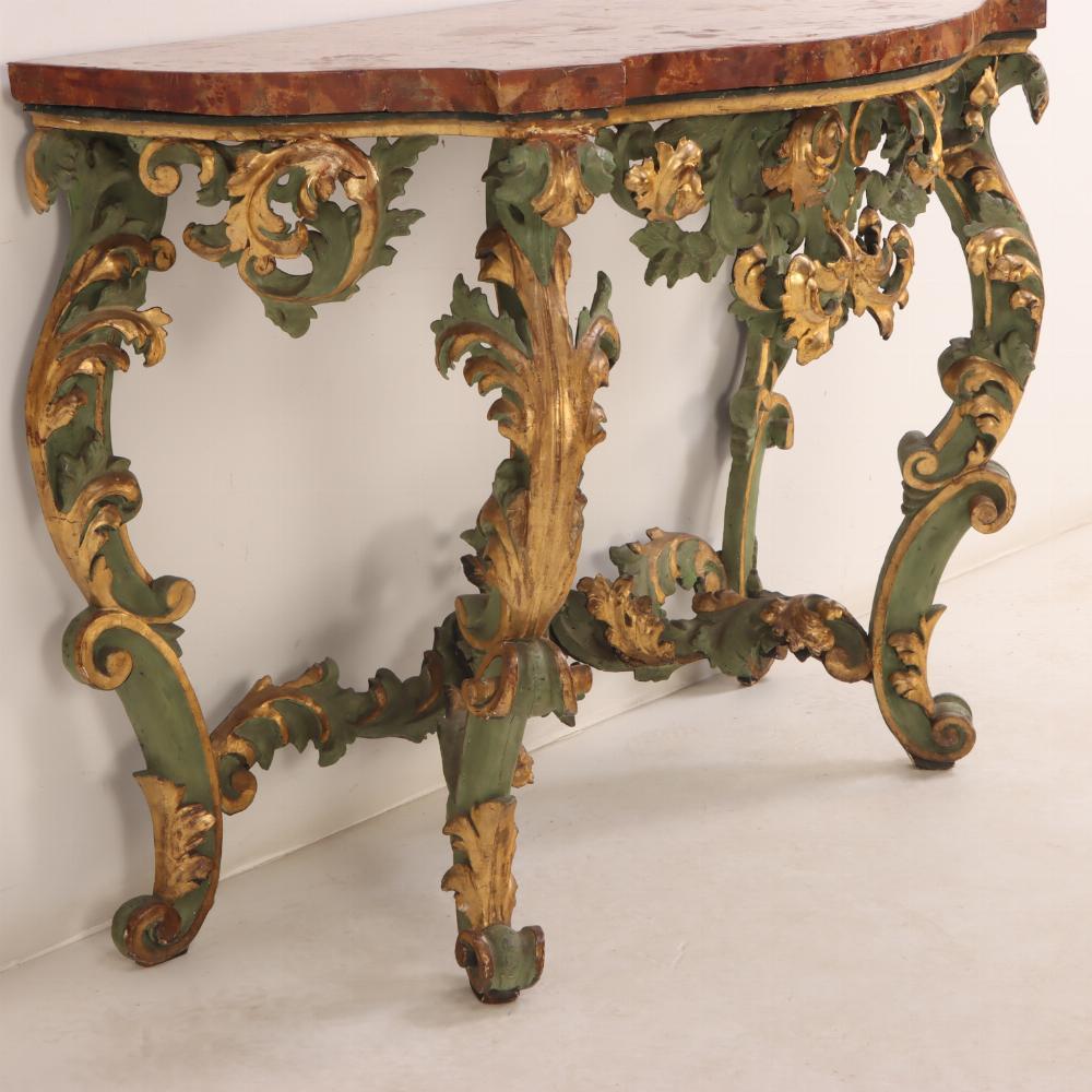 Carved An Italian faux marble top console table, 18th C. For Sale