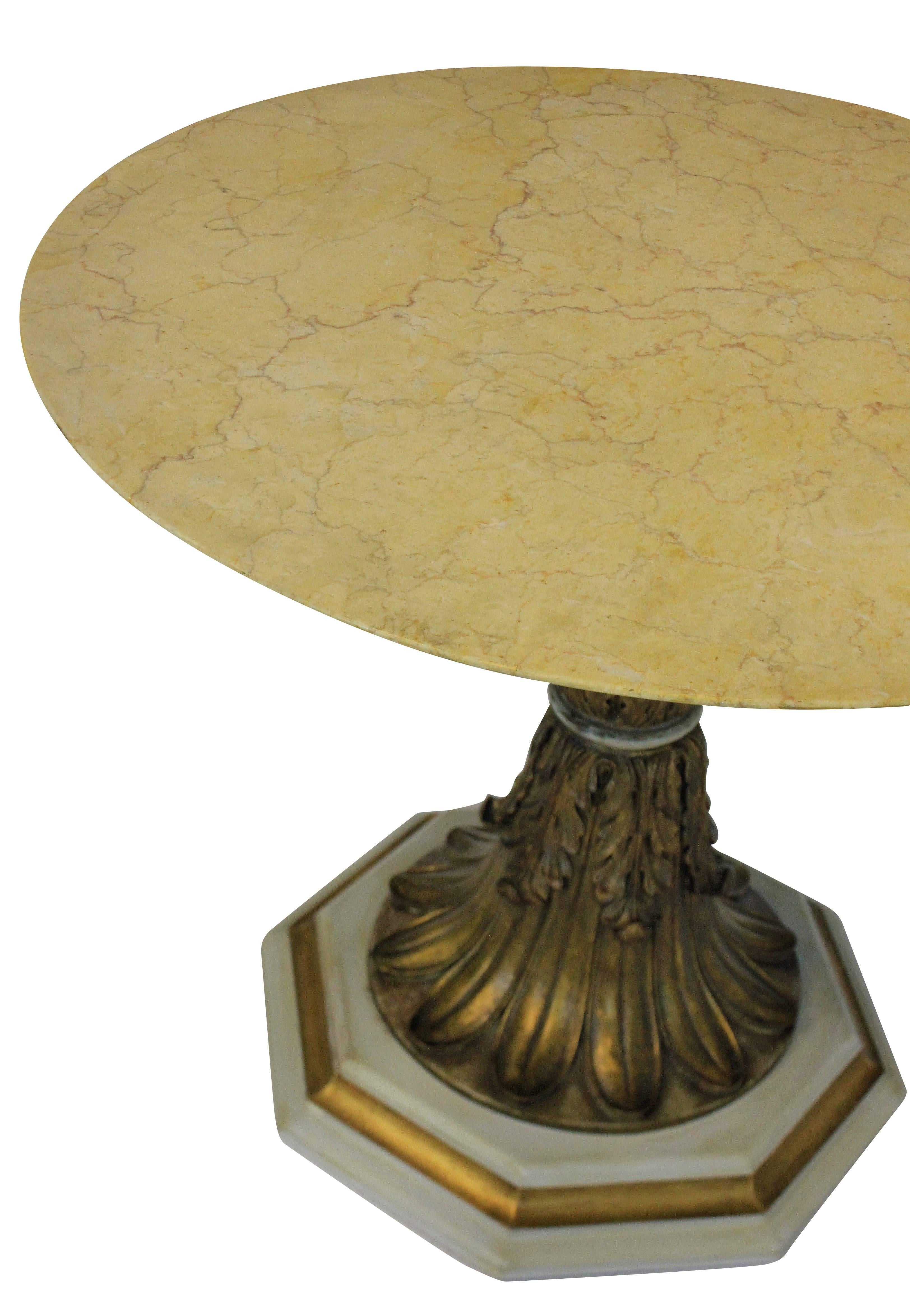 An Italian finely carved giltwood centre table depicting acanthus leaves with a circular Sienna marble top.

      