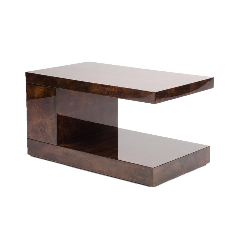 An Italian goat skin table by Aldo Turra, circa 1950. The structure of the table is made of wood and covered in lacquered goatskin in a rich dark brown color.