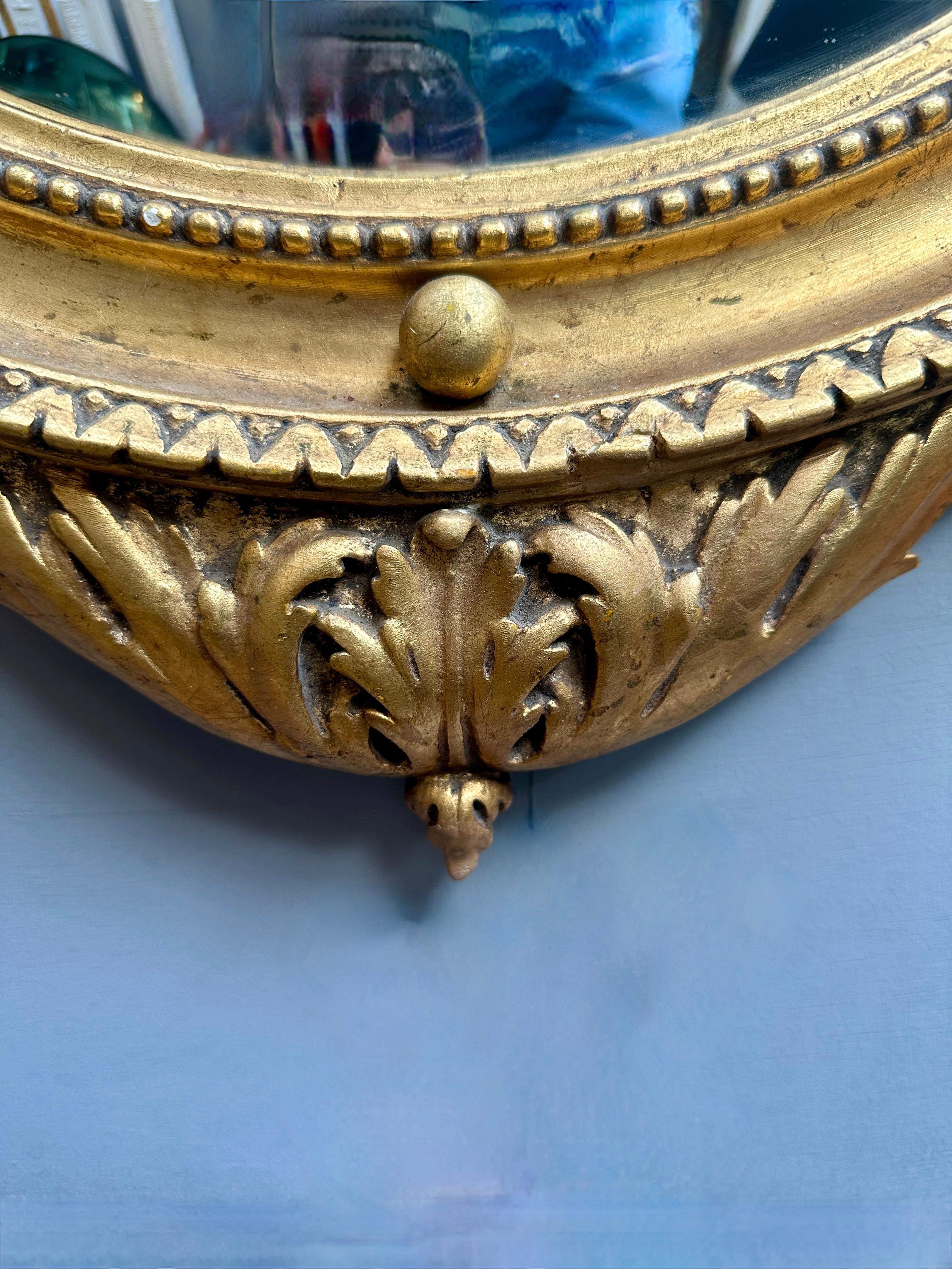 20th Century An Italian Gold Gilt Regency Style Convex Mirror For Sale